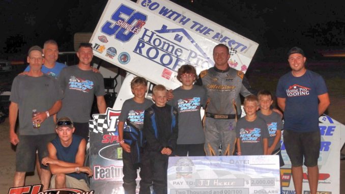 J.J. Hickle with his race team in victory lane Friday at I-96 Speedway. (Jim Denhamer photo)