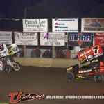 Paul Nienhiser (#9) pulling away from Will Armitage (#7A) Friday at Lincoln Speedway. (Mark Funderburk photo)