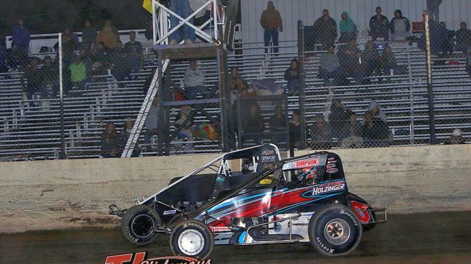 Max Frank (#25) noses ahead of Steve Irwin (#0) at the finish line to win the Great Lakes Traditional Sprints feature at Crystal Motor Speedway. (Jim Denhamer photo)