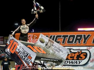 Scot Bogucki celebrates his feature victory Sunday night at Huset's Speedway. (Tyler Porath Photo)