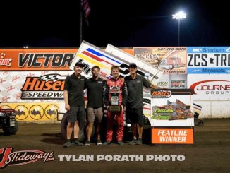 Garet Williamson with his race team in victory lane Sunday night at Huset's Speedway. (Tyler Porath Photo)