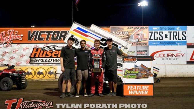 Garet Williamson with his race team in victory lane Sunday night at Huset's Speedway. (Tyler Porath Photo)