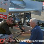 Mike Ordway discussing strategy after practice a Berlin Raceway. (T.J. Buffenbarger photo)