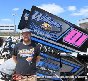 Tyler Gunn standing next to the Williams Seal Coating sprint car. (T.J. Buffenbarger Photo)