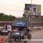 Daison Pursley being pushed through the pit area as qualifying is shown on the jumbotron at Eldora Speedway. (T.J. Buffenbarger Photo)