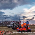 Kyle Larson (#57), Corey Day (#14), and Giovanni Scelzi (#18) racing three wide during the 2024 Brad Doty Classic at Attica Raceway Park. (Dan McFarland Photo)