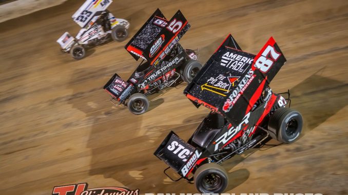 Aaron Reutzel (#87), Spencer Bayston (#5), and Garet Williamson (23) racing for position during the Jokers Jackpot Thursday night at Eldora Speedway. (Dan McFarland Photo)