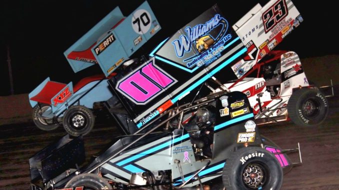 Chase Ridenour (#01), Eli Lakin (#70), and Devin Dobie (#23) racing for position Friday at Tri-City Motor Speedway. (Jim Denhamer Photo)