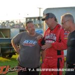 Van Gurley Jr. discussing his car with Fuzz Lyons and his crew. (T.J. Buffenbarger Photo)