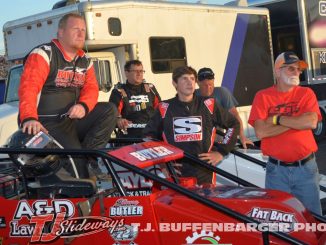 Shane and Landon Butler watch qualifying with their crew at Kalamazoo Speedway. (T.J .Buffenbarger Photo)