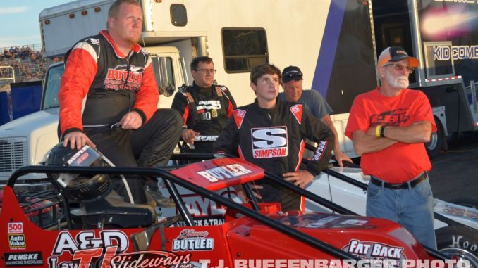 Shane and Landon Butler watch qualifying with their crew at Kalamazoo Speedway. (T.J .Buffenbarger Photo)