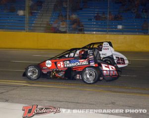Tyler Roahrig (#56) passing Jake Trainor (#29) for the lead Saturday night at Berlin Raceway. (T.J. Buffenbarger Photo)