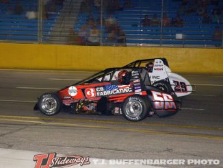 Tyler Roahrig (#56) passing Jake Trainor (#29) for the lead Saturday night at Berlin Raceway. (T.J. Buffenbarger Photo)