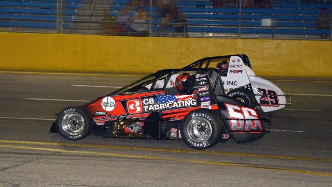 Tyler Roahrig (#56) passing Jake Trainor (#29) for the lead Saturday night at Berlin Raceway. (T.J. Buffenbarger Photo)