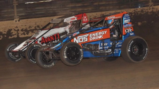 Justin Grant (#4) racing with Kyle Cummins (#3) Thursday night at Kokomo Speedway. (Jim Denhamer Photo)