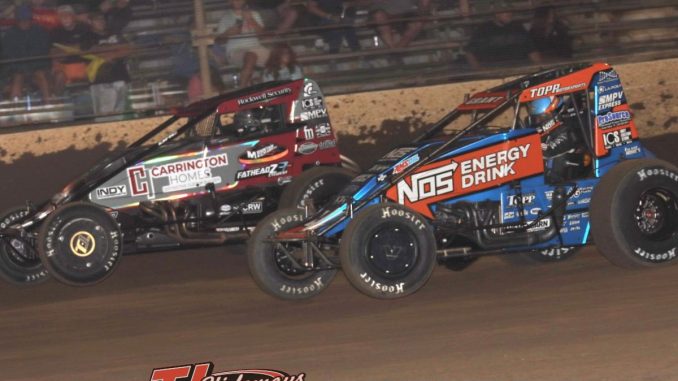 Justin Grant (#4) racing for the lead with Logan Seavey (#57) Thursday night at Kokomo Speedway. (Jim Denhamer Photo)