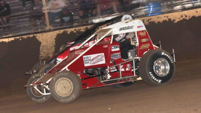 Robert Ballou (#12) inside of C.J. Leary (#15) for position Thursday night at Kokomo Speedway. (Jim Denhamer Photo)