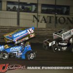 Donny Schatz (#15) racing with Logan Schuchart (#1S) for the lead Friday night at Knoxville Raceway. (Mark Funderburk Photo)