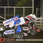 James McFadden (#83) racing with Ryan Timms (#5T) Thursday night at Knoxville Raceway. (Mark Funderburk Photo)