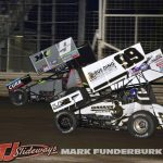 Skylar Gee (#99) and Kasey Kahne (#9) racing for position Friday at Knoxville Raceway. (Mark Funderburk Photo)