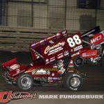 Austin McCarl (#88) racing with Emerson Axsom (#27) Friday at Knoxville Raceway. (Mark Funderburk Photo)