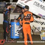 James McFadden, Sheldon Haudenschild, and Kyle Larson discuss the feature event Friday at Federated Auto Parts Raceway at I-55. (Mark Funderburk Photo)