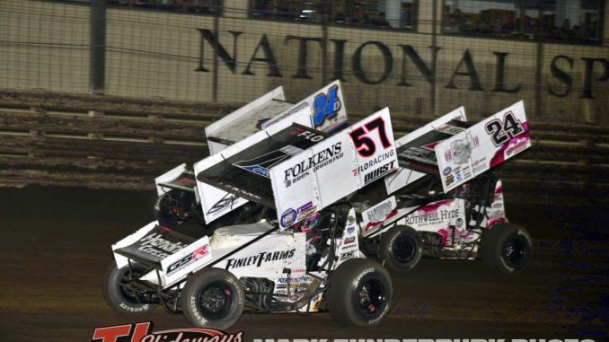 Kyle Larson (#57) gets by Rico Abreu (#24) for the lead at Knoxville Raceway while lapping Danny Sams III (#24D). (Mark Funderburk Photo)