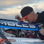 Clinton Boyles leans in with some words of wisdom for Mitchel Moles before USAC Silver Crown Series qualifying. (T.J. Buffenbarger Photo)