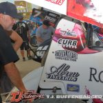 Rico Abreu strapped in while Ricky Warner gives the car a final look over before qualifying at Eldora Speedway. (T.J. Buffenbarger Photo)