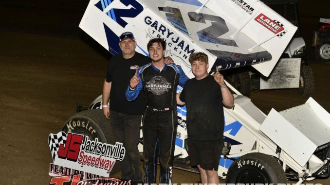 Corbin Gurley with his family and crew in victory lane Friday at Jacksonville Speedway. (Mark Funderburk Photo)