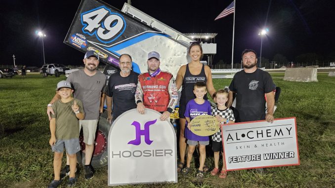 Josh Schneiderman and family celebrate his win at Bloomfield with Mike Mohrfeld (Mohrfeld Solar) and Son on the left. (Image courtesy of the Sprint Invaders Association)