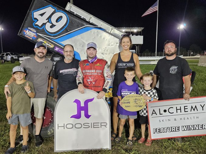Josh Schneiderman and family celebrate his win at Bloomfield with Mike Mohrfeld (Mohrfeld Solar) and Son on the left. (Image courtesy of the Sprint Invaders Association)