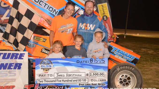 Jared Horstman with his wife and daughters in victory lane at I-96 Speedway. (T.J. Buffenbarger Photo)