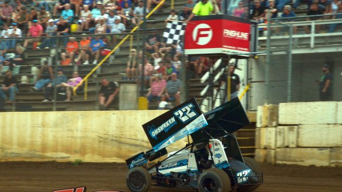 Dan McCarron takes the checkered flag Saturday at Butler Motor Speedway. (T.J. Buffenbarger Photo)