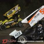 Gregg Dalman (#49t) racing with Steve Irwin (#5m) Friday at Tri-City Motor Speedway. (Jim Denhamer Photo)