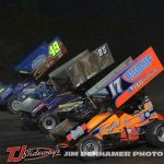 Brian Ruhlman (#49), Dustin Daggett (#85), and Jared Horstman (#17) racing three wide Friday at Tri-City Motor Speedway. (Jim Denhamer Photo)