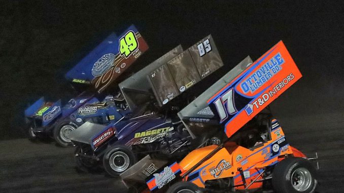 Brian Ruhlman (#49), Dustin Daggett (#85), and Jared Horstman (#17) racing three wide Friday at Tri-City Motor Speedway. (Jim Denhamer Photo)