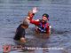 Driver C.J. Leary and team owner Mike Burkhart took the plunge into the infield lake after winning Saturday's Ted Horn 100 USAC Silver Crown race at the Du Quoin State Fairgrounds in southern Illinois. (Rich Forman Photo)