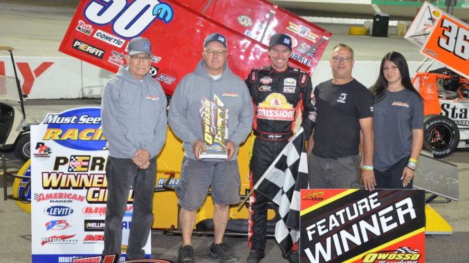 DSC_0436 Kody Swanson with his car owner Dick Meyers and crew in victory lane Sunday night at Owosso Speedway. (T.J. Buffenbarger Photo)