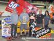 Kody Swanson with his car owner Dick Meyers and crew in victory lane Sunday night at Owosso Speedway. (T.J. Buffenbarger Photo)