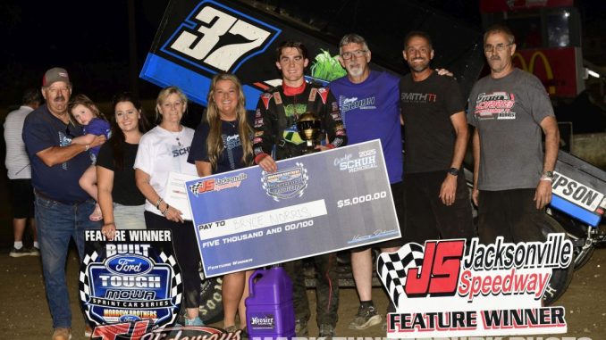 Bryce Norris with family and crew after winning the MOWA Sprint Car feature Friday night at Jacksonville Speedway. (Mark Funderburk Photo)