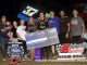 Bryce Norris with family and crew after winning the MOWA Sprint Car feature Friday night at Jacksonville Speedway. (Mark Funderburk Photo)