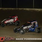 Mario Clouser (#6) racing with Justin Grant (#4) Friday at Tri-City Speedway. (Mark Funderburk Photo)