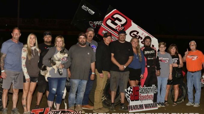 Jake Neuman with family and crew members after winning the feature event Friday at Jacksonville Speedway. (Mark Funderburk Photo)