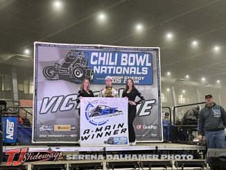 Emerson Axsom in victory lane after winning the feature event Wednesday night at the Chili Bowl Nationals. (Serena Dalhamer Photo)