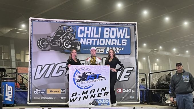 Emerson Axsom in victory lane after winning the feature event Wednesday night at the Chili Bowl Nationals. (Serena Dalhamer Photo)