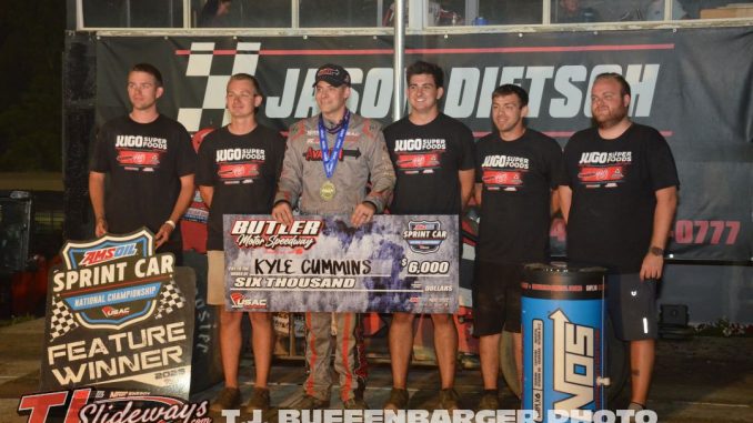 Kyle Cummins with his crew in victory lane Saturday night at Butler Motor Speedway. (T.J. Buffenbarger Photo)