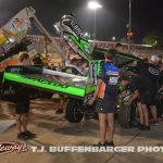 Multiple team members helping to get Carson Macedo back into action after a first lap crash during the feature at Eldora Speedway. (T.J. Buffenbarger Photo)