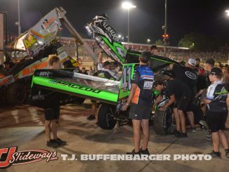 Carson Macedo's entry being reassembled by multiple teams in work area Friday night at Eldora Speedway. (T.J. Buffenbarger Photo)