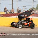 Geoff Wade gets into the wall during heat race action at Berlin Raceway. (T.J. Buffenbarger Photo)